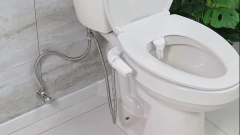 Step-by-step installation of Lesviv Bidet attachment on a toilet." "Easy Lesviv Bidet installation process for Nigerian homes." "Quick and simple Lesviv Bidet setup for any standard toilet." "Lesviv Bidet being installed: No plumbing expertise required." "Hassle-free Lesviv Bidet installation in a modern Nigerian bathroom." "Lesviv Bidet attachment installation guide for a cleaner bathroom experience." "Affordable Lesviv Bidet setup: Upgrade your toilet in minutes." "Demonstrating how to install a Lesviv Bidet for eco-friendly hygiene." "Lesviv Bidet installation process: A perfect fit for Nigerian toilets." "Installing Lesviv Bidet: Save money and reduce waste effortlessly